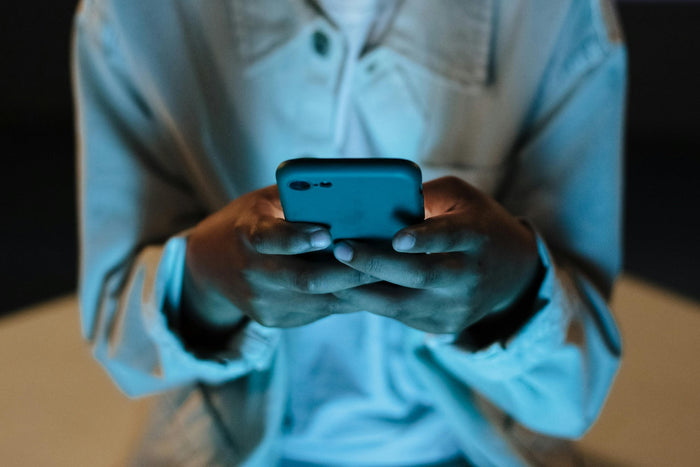 A man texting on a phone