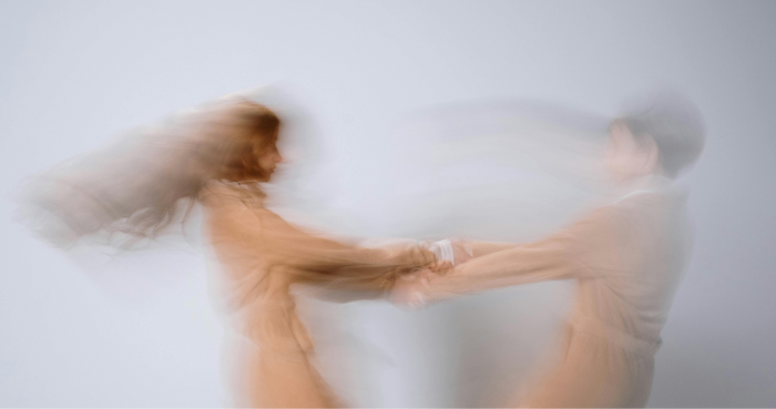 Two people spinning