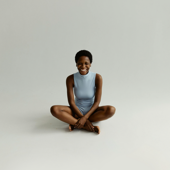 Person sitting with no background and plain clothes