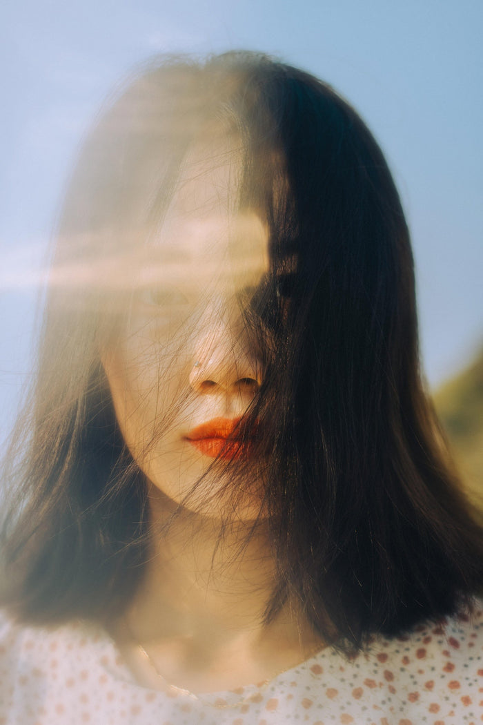 Woman with aura light around her face